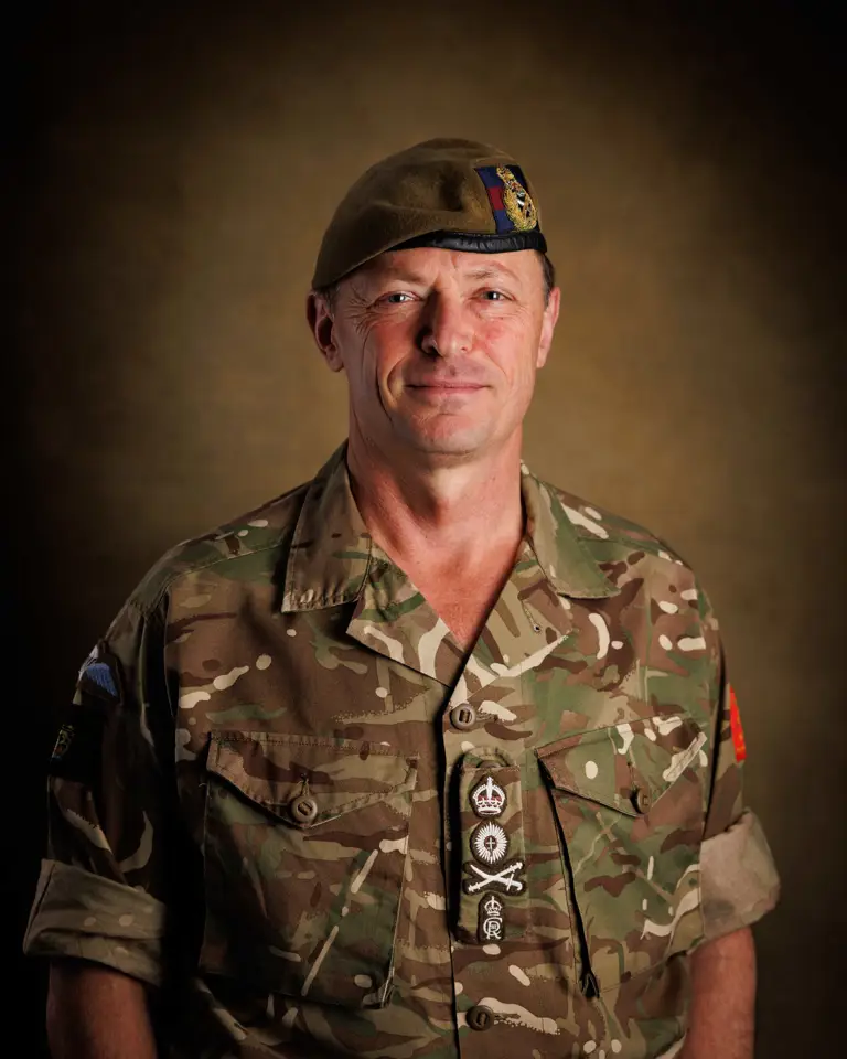 A portrait of an officer in uniform.