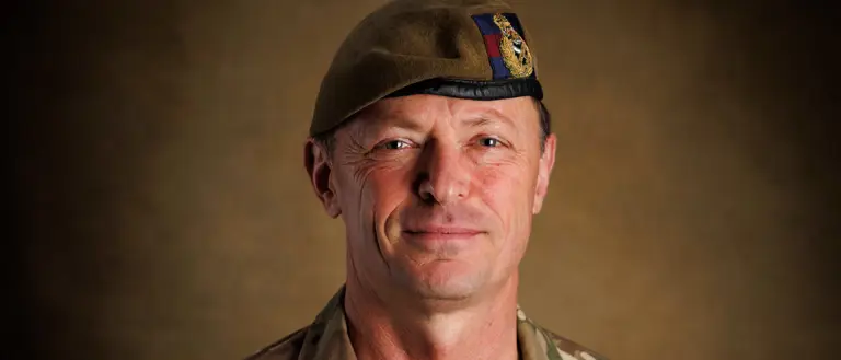 A portrait of an officer in uniform.