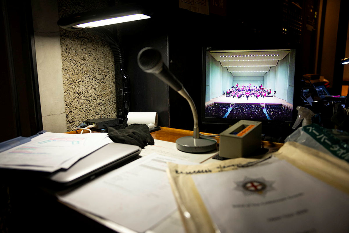 paper and microphone on desk. 