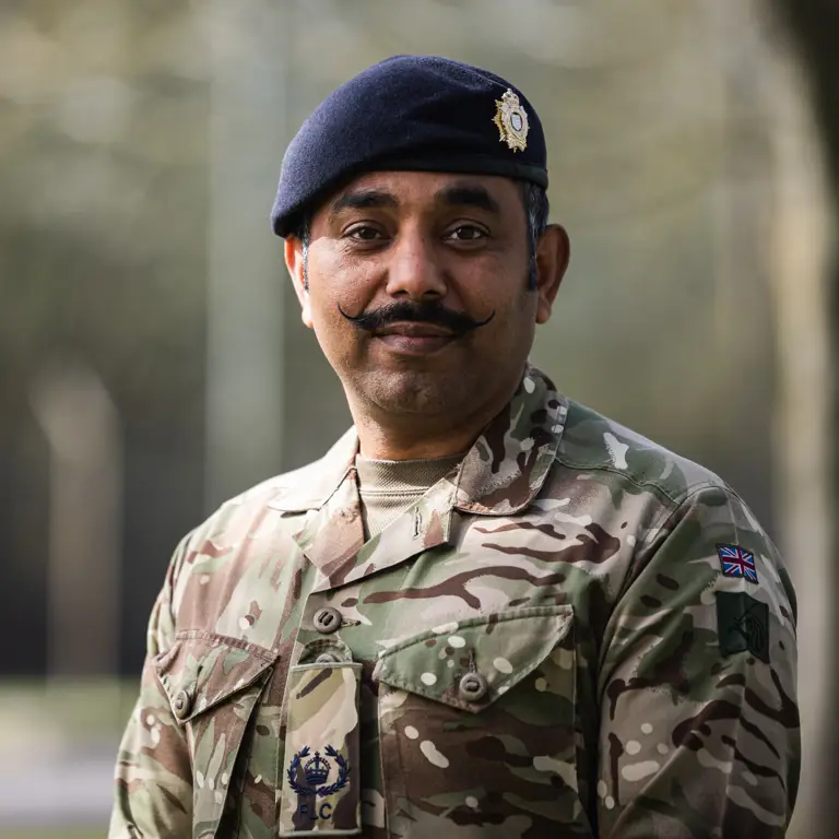 A portrait of Warrant Officer Class 2 (WO2) Vikas Talwar, a system analyst within the Royal Logistic Corps.