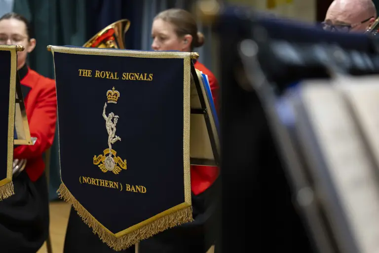 Close-up of a blue music stand banner with