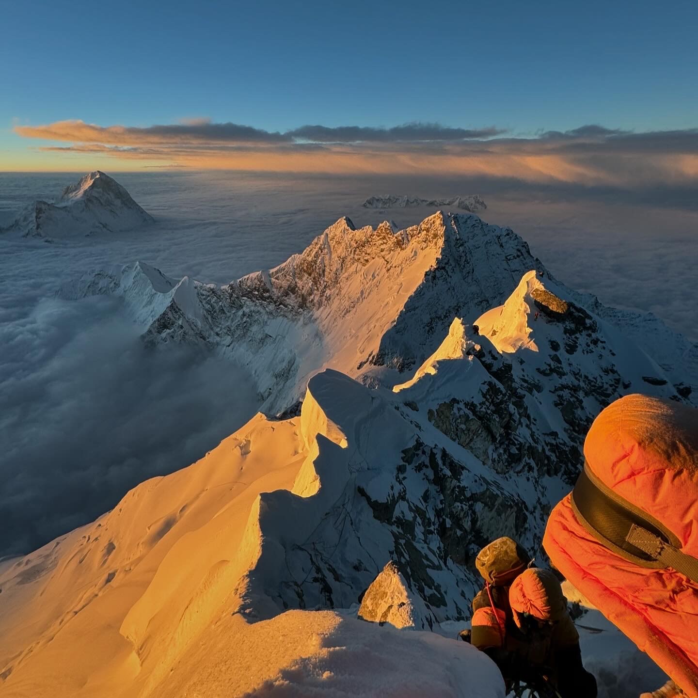 The famous mountain rage of Everest - there are snow capped mountains that sit above the clouds.
