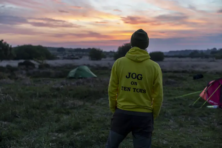 A person in a yellow hoodie with