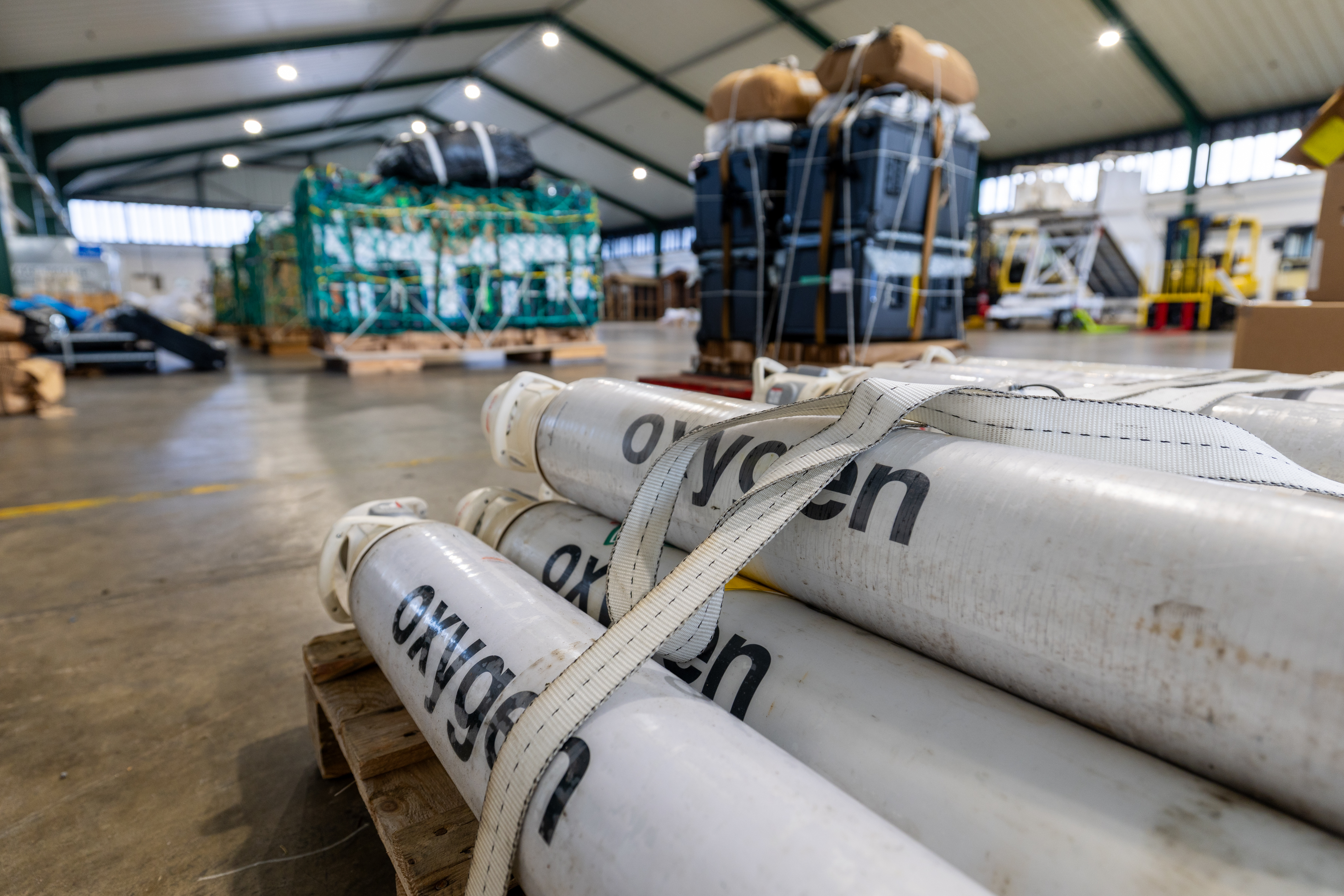 White oxygen cylinders labeled 