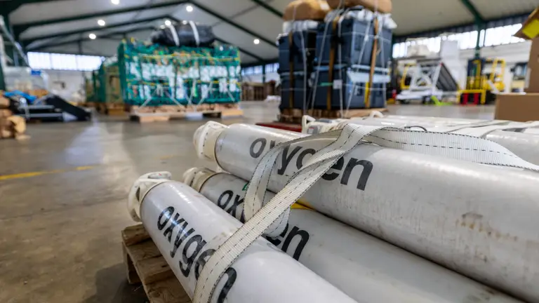 White oxygen cylinders labeled