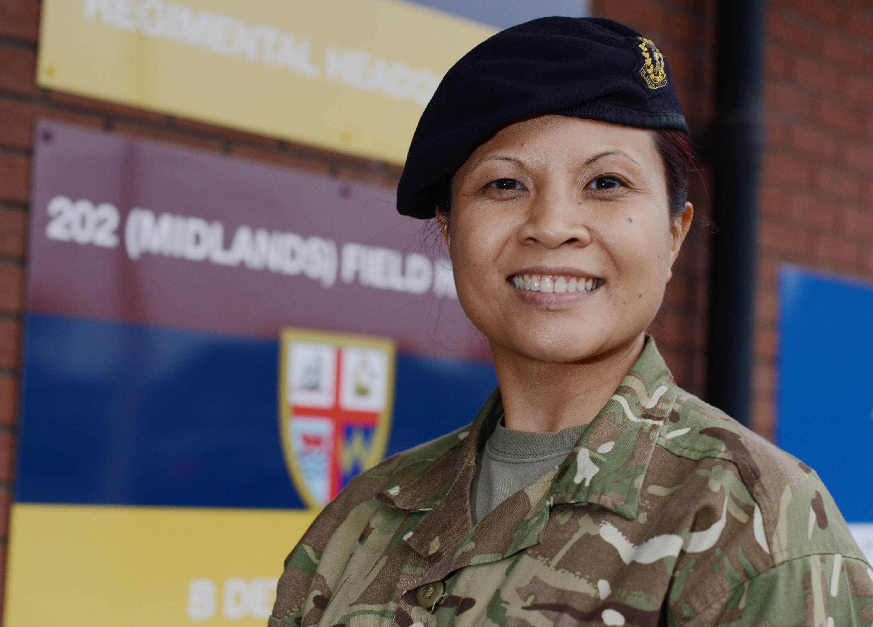 A lady is pictured in uniform.
