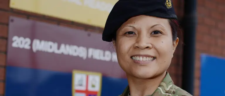 A lady is pictured in uniform.