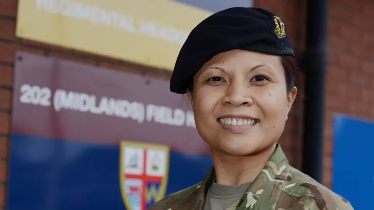 A lady is pictured in uniform.