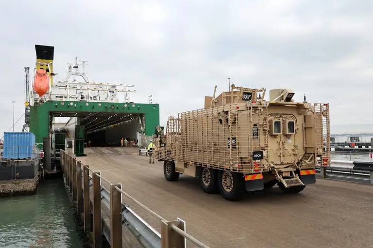 A Cyote vehicle is seen being driven onto the ship ready for transportation.