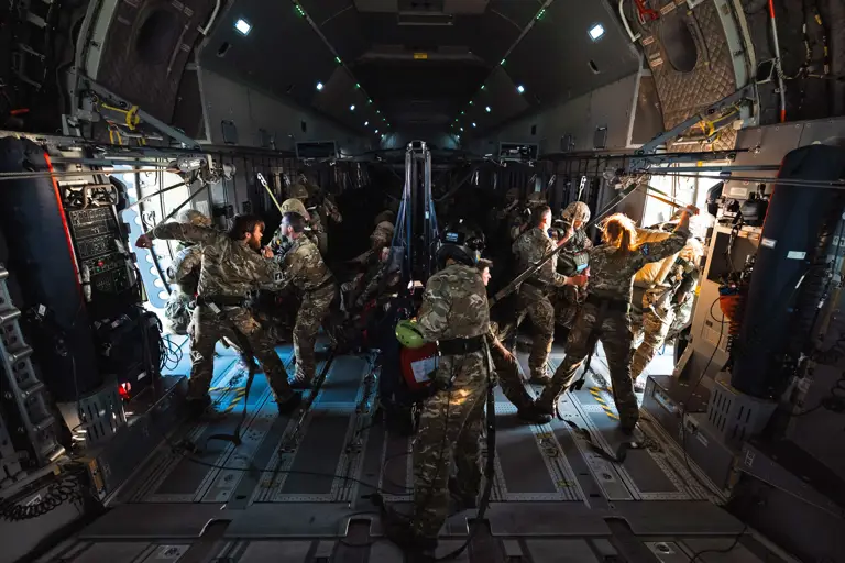 Paratrooper onboard ATLAS C.1 A400M getting ready to jump out mid flight.