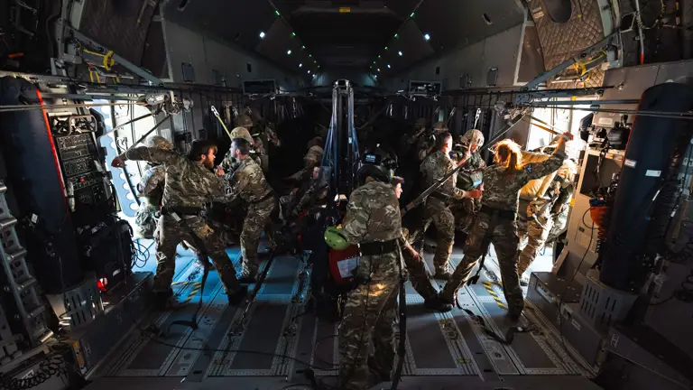 Paratrooper onboard ATLAS C.1 A400M getting ready to jump out mid flight.