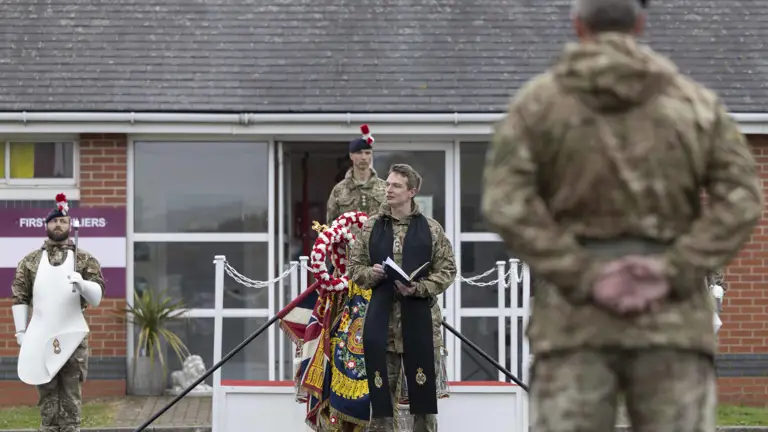 A Padre delivers a prayer on a parade.