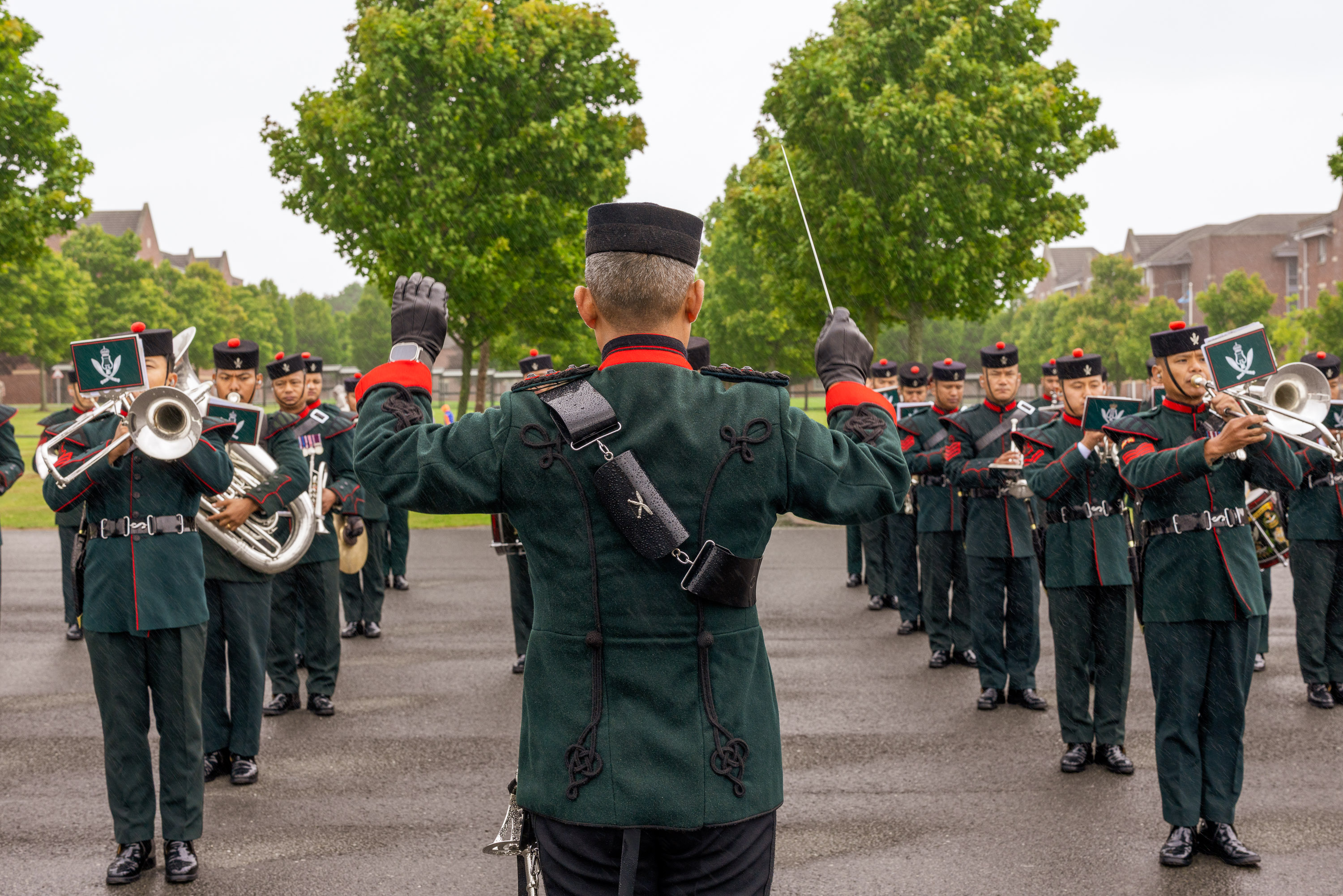 The Band of The Brigade of Gurkhas performing in their green ceremonial uniform at the AFC Harrogate Graduation Parade