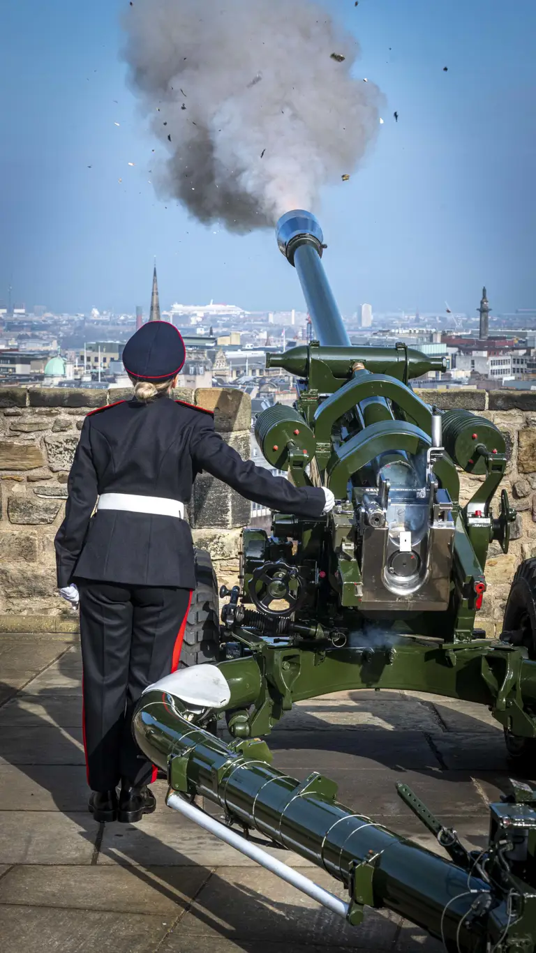 Caroline Gallagher is shown in No.1 dress uniform stood back to the camera having fired out the gun salute on top of Edinburgh Castle.